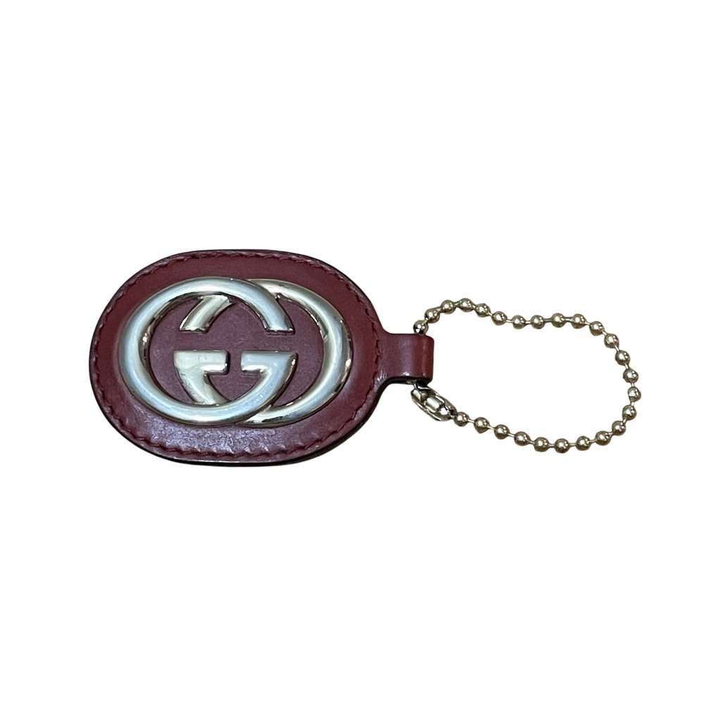 Gucci Sukey Interlocking GG Burgundy Leather Oval Keychain Gold Tone Bag Charm
